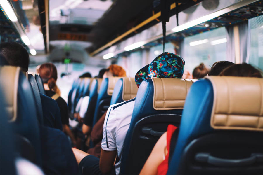 Overhead bins and leather seats on a shuttle bus